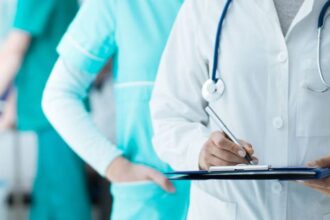 bigstock doctors checking medical recor 225737713