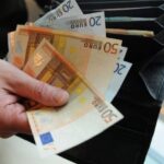 a man counts euro bills in bratislava on december 7 2011 2