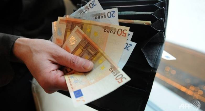 a man counts euro bills in bratislava on december 7 2011 2