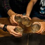 overhead vie friends holding glass cocktails 1536x1024 1