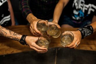 overhead vie friends holding glass cocktails 1536x1024 1
