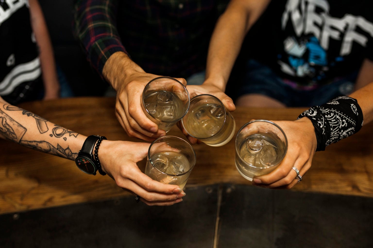 overhead vie friends holding glass cocktails 1536x1024 1